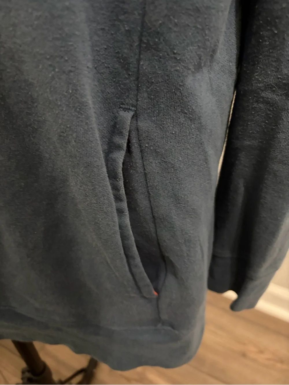 The North Face Blue Pullover Hoodie with Orange Hood and Drawstrings